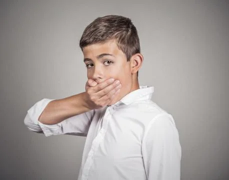 Man looking surprised, hand covering mouth Stock Photos