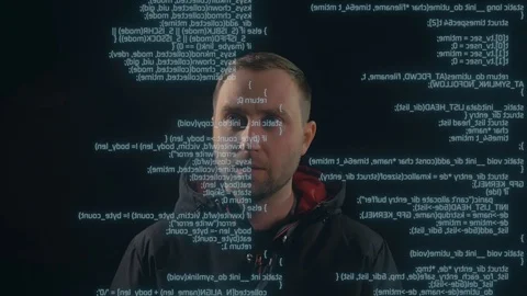 Man is looking on the text, code, script on the screen in front of him. Stock Footage 106301632
