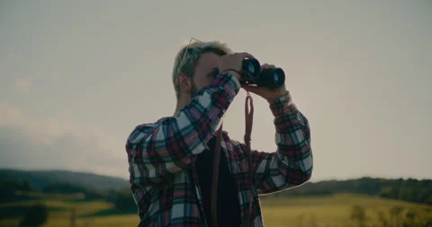 Man Looking Through Binocular During Sunny Day Stock Footage 252016791