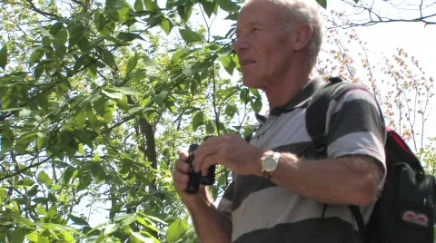 Man looking through binoculars  Video stock 499700