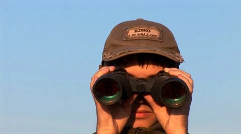 Man looking through Binoculars Stock Footage 8681263