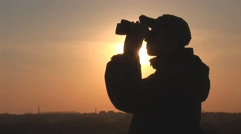 Man looking through Binoculars Stock Footage 8681264