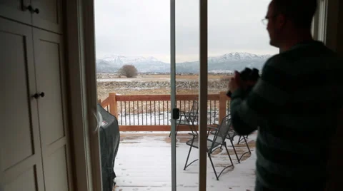 Man looking through binoculars Stock Footage 32821068