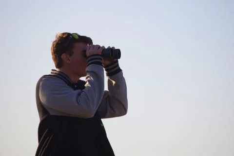 Man looking through binoculars Stock Photos