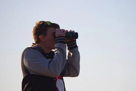 Man looking through binoculars Stock Photos