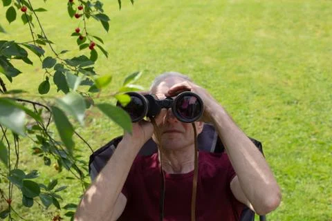 A man looking through the binoculars Stock Photos
