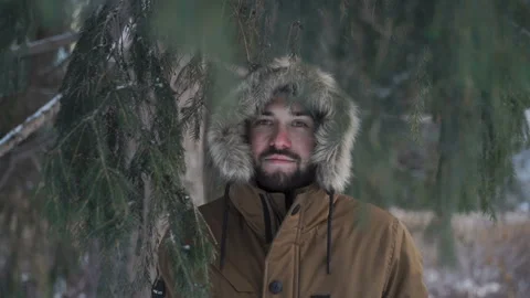 Man is looking through the branches Stock Footage 86374348