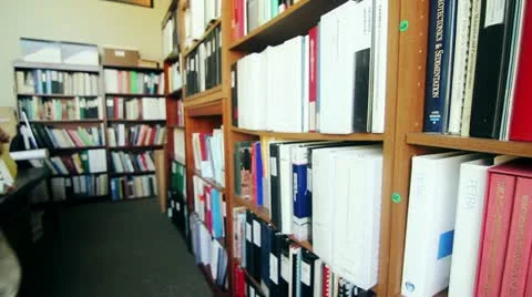 Man looking through business library Stock Footage 10978535