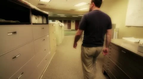 Man looking through file cabinets Stock Footage 10976765