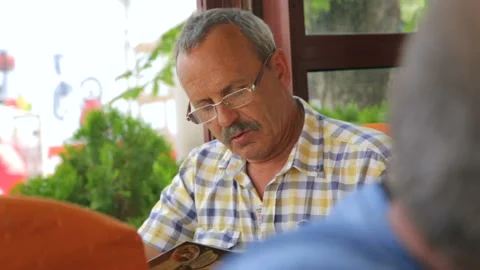 Man is looking through menu in cafe Stock Footage 96354893