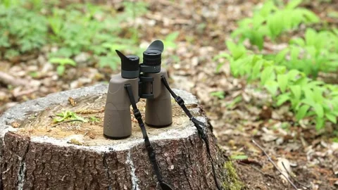 A man is looking through a pair of military binoculars. Stock Footage 143700612