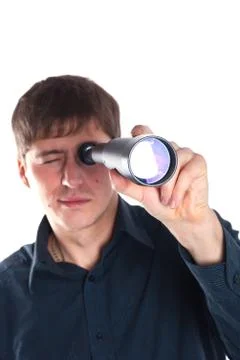 Man looking through a telescope Stock Photos