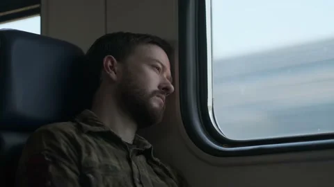 A man looking through the train window Stock Footage 136179815