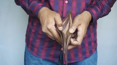 Man Looking Through Wallet Empty Of Cash, No Money and cards financial debt Stock Footage 336450603