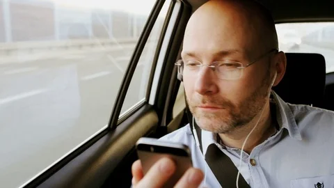Man Looking Through a Window and at a Mobile Stock Footage 74766736
