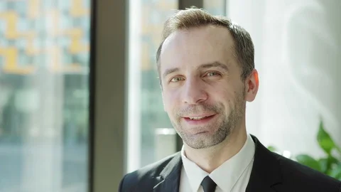 Man looking through window and smiling at camera Stock Footage 108680701