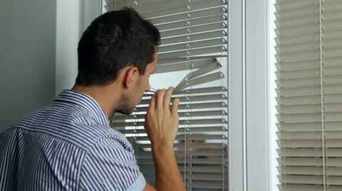 Man looking through a window Stock Footage 45164354