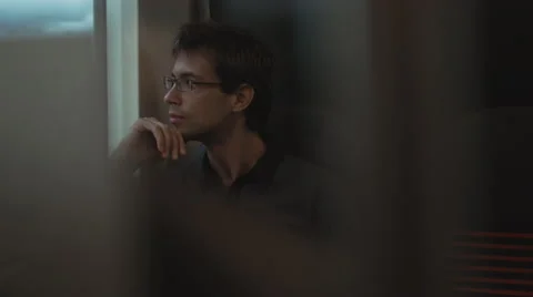 Man Looking through Window in Moving Train Stock Footage 56435080