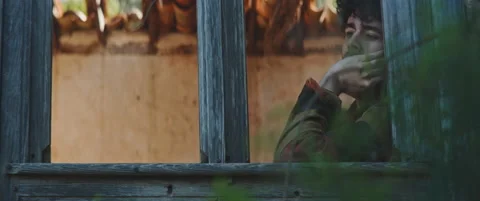 Man looking through window pensive Stock Footage 202266836