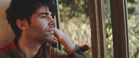 Man looking through window pensive profile Stock Footage 202267133