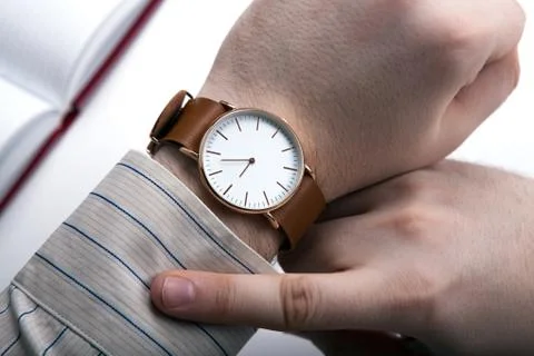 Man looking at the time close up Stock Photos