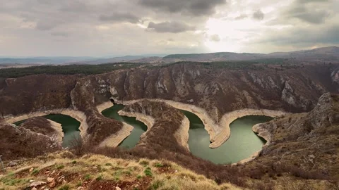 Man looking at Uvac River canyon Serbia scenic viewpoint travel destination Stock Footage 332167169