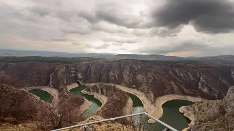 Man looking at Uvac River canyon Serbia scenic viewpoint travel destination Stock Footage 332167345