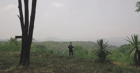 Man looking at view on mountain aerial Stock Footage 89701979