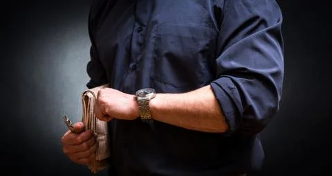Man looking watch Stock Photos