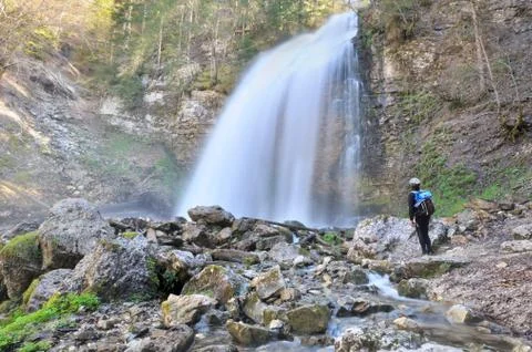 Man looking waterfall in mountain Stock Photos