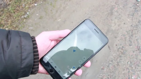 Man looking for a way on a smartphone Stock Footage 111180409