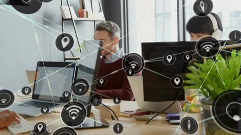 Man looking up while hands typing in office, typing initiating network nodes Stock Footage 334312617