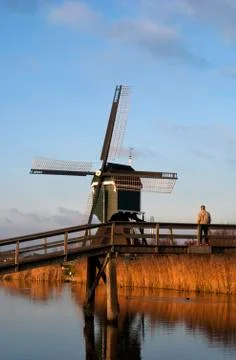 Man looking at windmill Stock Photos