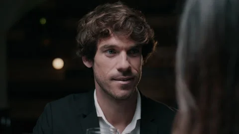 Man looking at woman in a restaurant while she talks Video stock 131248490