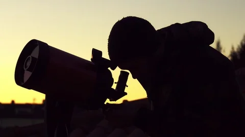 Man looks for alien in telescope Stock Footage 111340515