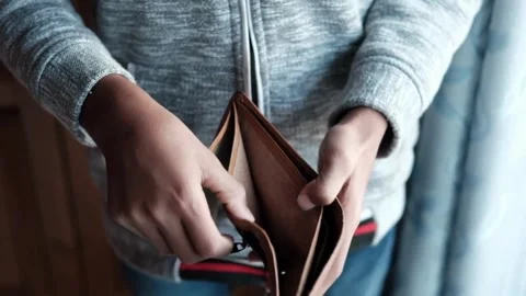 Man looks into and showing empty wallet. Inflation money unemployment Bankruptcy 스톡 동영상 336450590