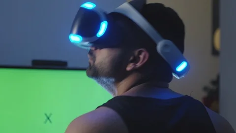 Man Looks Around and Interacts with Virtual Reality Game in Awe and Wonder Stock Footage 108880846