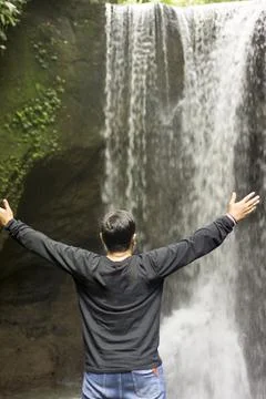 The man looks back. Abstract background and waterfall bokeh. Nice illustratio Stock Photos