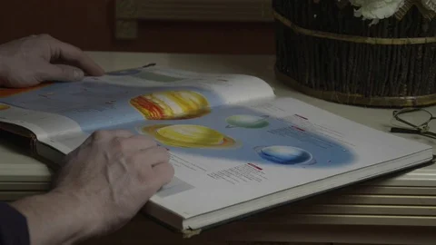 A man looks at a book Stock Footage 74195295