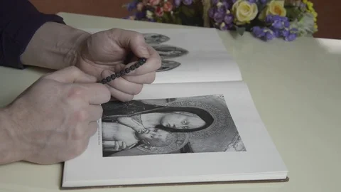 A man looks at a book 스톡 동영상 74195339