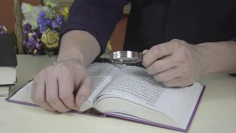 A man looks at a book Stock Footage 74195397