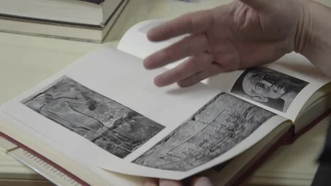 A man looks at a book Stock Footage 74195480