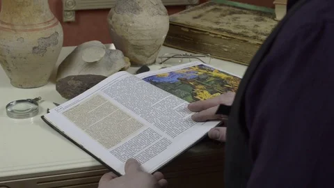 A man looks at a book Stock Footage 74340358