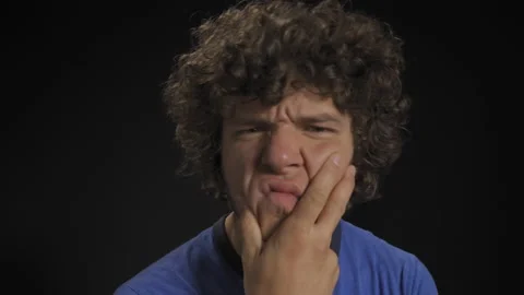 Man looks into the camera with doubt. He's priced in and he's trying to make a Stock Footage 139470635