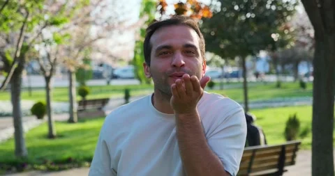 Man looks at camera, making gestures and facial expressions that say "call me" Stock Footage 306182574
