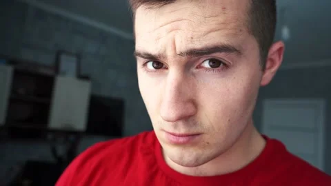 Man looks at the camera in surprise Stock Footage 146359208