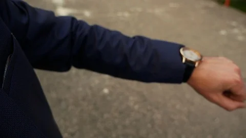 The man looks at the clock Stock Footage 98453329