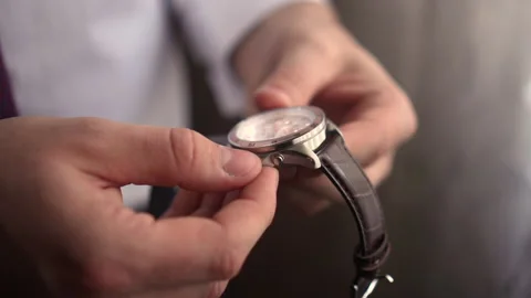 A man looks at a clock Stock Footage 167355658