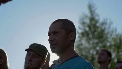 Man looks closely at something Stock Footage 82408441