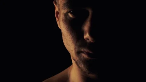 Man looks on a dark background Video stock 99682329